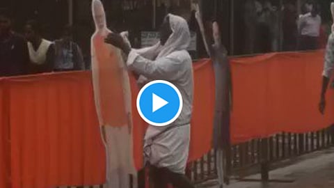 karnataka election 2023 man seen cleaning pm narendra modi cutout amit shah praised watch viral video  