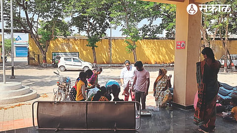Health workers treating a woman who has given birth at the entrance of Chandori Primary Health Centre.