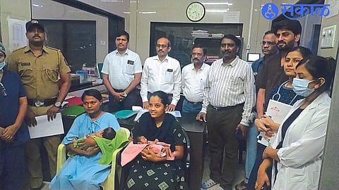 Mothers, doctors and police personnel with their babies.
