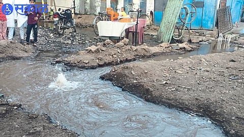 Water leakage from valve in open plot in front of Reliable Estate near Daregaon
