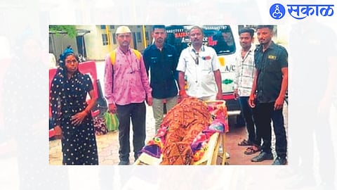 Gajanan Kshirsagar and hospital staff taking an elderly woman home after successful treatment.