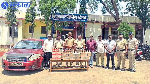 Assistant Police Inspector Shrikrishna Pardhi and team of Pimpalner Police Station along with confiscated goods preventing the smuggling of liquor from cars.
