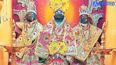 Attractive idols of Vitthal, Rukmini and Satyabhama decorated in the background of Ashadhi in Vitthal temple.
