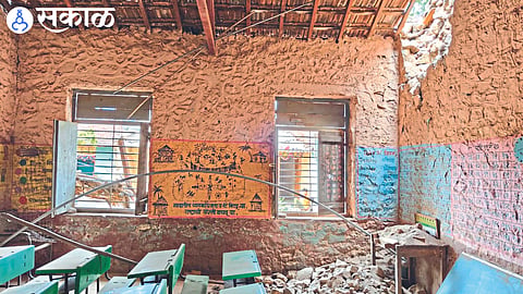 Fallen wall of the school, on the other side a sign saying dangerous building.
