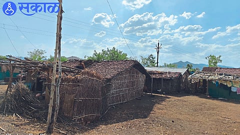 Citizens changing the roofs of their houses before monsoon.
