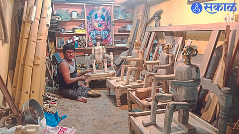 Artisan Sanjay Mistry making various parts of Kanu Mata from wood.
