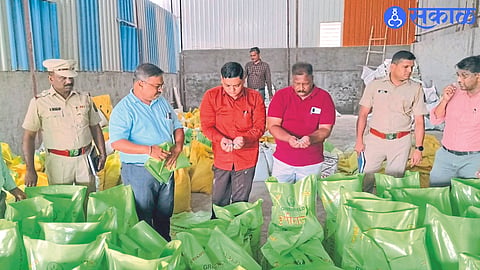 Agriculture and police officers inspecting stock of fake fertilizers in a godown in MIDC.
