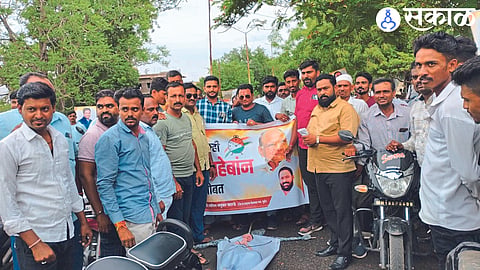 Lalit Warude and NCP protesters protesting against Ajit Pawar.
