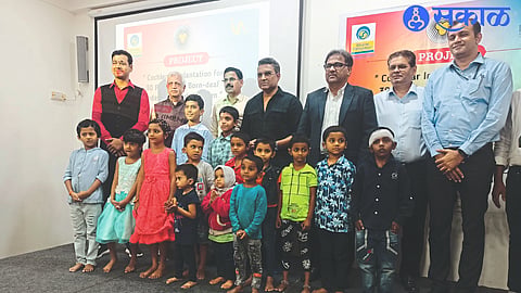 Cricket commentator Sanjay Manjrekar with children who have successfully undergone cochlear implant surgery