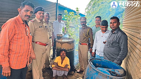 Officials in action against village alcohol.
