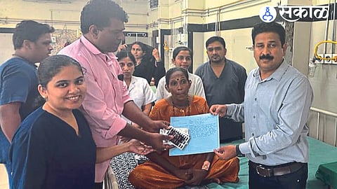While saying goodbye to a woman who was cured of cervical cancer surgery, Dr. Thakur.
