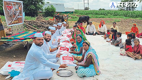 Officials and members of Shiledar Foundation while celebrating Rakshabandhan in a settlement.