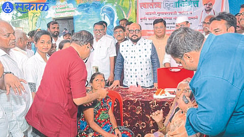 Guardian Minister Gulabrao Patil and others while distributing 'Abha' card in health camp.
