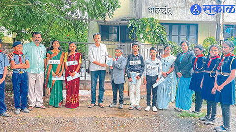 While appealing to support the campaign, Students dressed as Babasaheb Ambedkar and teacher

