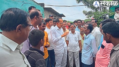 MLA Chimanrao Patil and officials while discussing the damage with the villagers.
