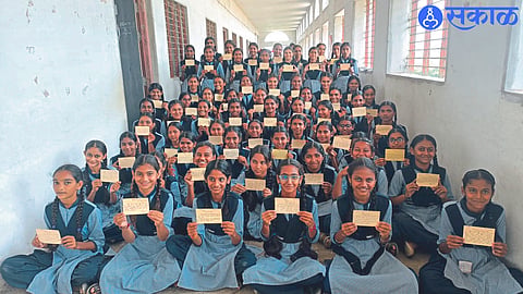 A student showing a letter written by a student of Adarsh ​​Madhyamik Vidyalaya