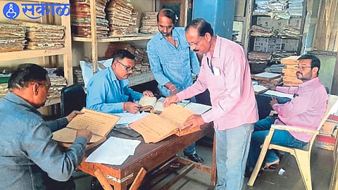 Nitin Joshi with the team while checking the records regarding the Maratha-Kunbi caste in the Municipal Corporation.