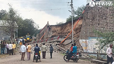 JCB while removing the filling of the fallen bridge