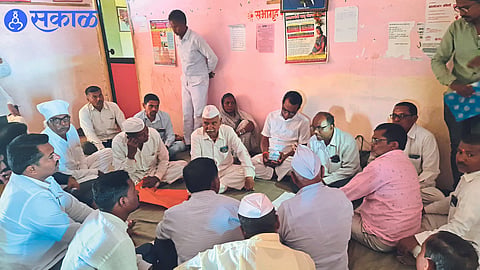 Gram Sevak Neighbor Villager giving information about scam of fake tax receipts in Gram Panchayat Office in Special Gram Sabha.
