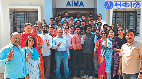 Winning candidate of Ekta panel cheering in front of AIMA office after victory.