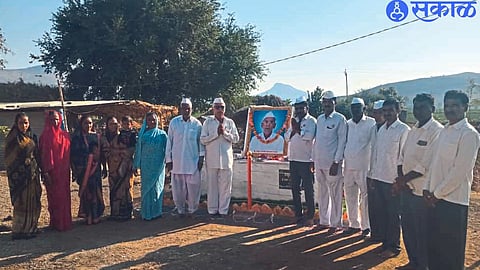 Jadhav family saluting their father's memorial built in front of the house.
