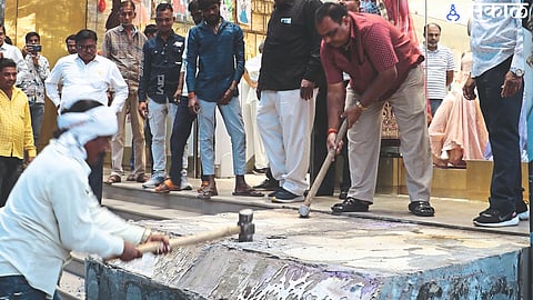 Employees of municipal encroachment department breaking Shital collection encroachment.
