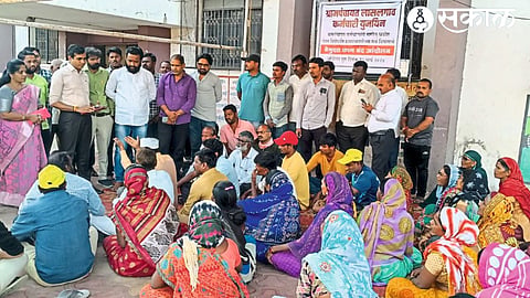 Group Development Officer Mahesh Patil discussing with the Gram Panchayat employees who are protesting the strike.