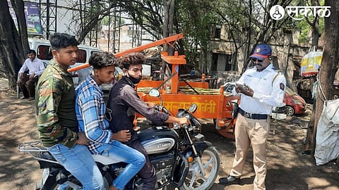 Traffic Police taking penal action against triple seat two wheeler drivers through e-challan as part of the drive against reckless driving by city traffic department.
