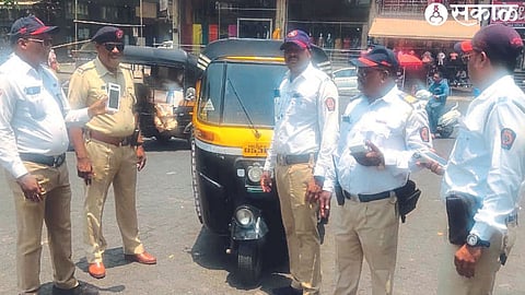 Traffic police taking action against drivers who flout traffic rules.