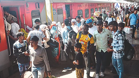 Crowd of passengers to board the reserved coach of the train.