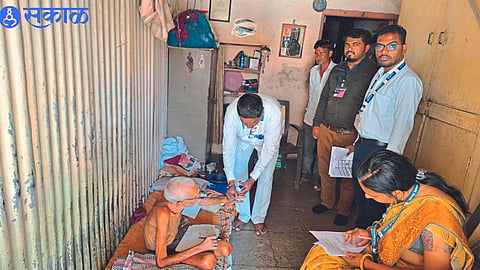 Electoral officers and staff while casting vote of 85-year-olds for Lok Sabha