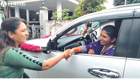 While congratulating BJP candidate Raksha Khadse sitting in the car outside the polling station, Adv. Rohini Khadse-Khewalkar.