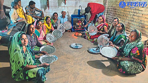 Self-help group women preparing letters at Entrepreneur Center.