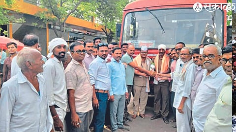 Villagers felicitating the bus driver and carrier.