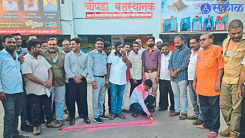 ST officials and staff expressing happiness by bursting firecrackers in the bus station premises.