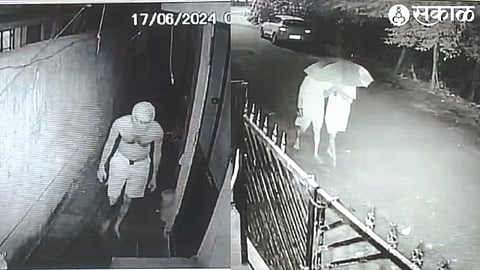 Thieves hiding their heads under umbrellas in Nageshwar Colony around 2.30 am on Monday morning & the thief entered the compound wearing only shorts and a mask over his face.
