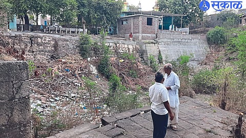 The ancient pond at Gram Panchayat Chowk, which is counting its last elements.