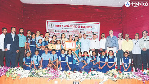 India Book of Records and Asia Book of Records certificate examiner of Spelling B competition of Zilla Parishad Chief Executive Officer Ashima Mittal while accepting from Dr. Chitra Jain 