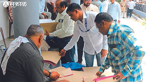 Election workers checking materials for voting in the Teachers' Constituency Elections.