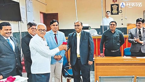 Chief District and Sessions Judge while honoring the party who compromised in the Lok Adalat held in the District Court. Ashutosh Karmarkar,
