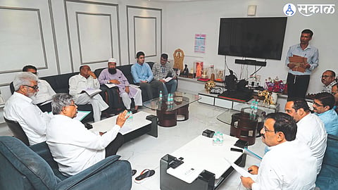 Guardian Minister Dada Bhuse in discussion with Textiles Minister Chandrakant Patil in Mumbai.