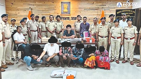Officers and staff of forest department with suspect in tiger skin smuggling case.