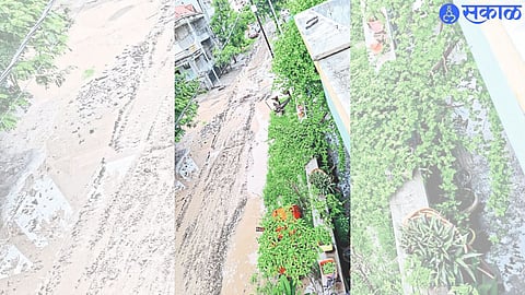 Muddy road in Gulmohar Colony.