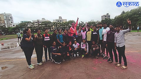 Coach Nikhil Shinde with his girlfriend celebrating by picking up Pratima Tupe.
