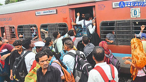 Passengers trying to board the bogie when there is no space in the carriage