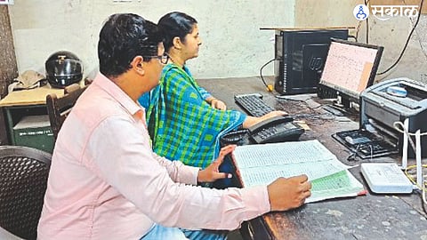 Sandesh Poonam Patil and Amit Deshmankar, employees of the Water Resources Department, in the flood control room.