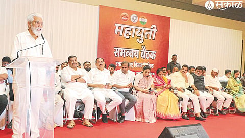 Minister Dada Bhuse while speaking at the coordination meeting of Mahayuti on Monday. Various officials on the dais.