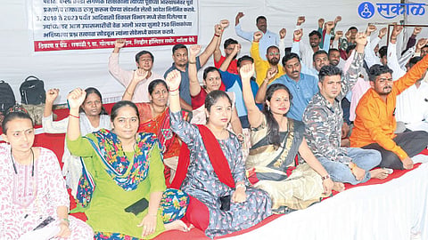 Contract arts, sports and computer teachers of tribal development department while protesting on Monday.