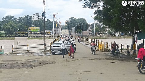 Traffic started over the small bridge as the Panjre flood receded.