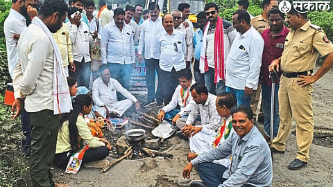 Nationalist Congress Party official Sharad Chandra Pawar preparing a stove and cooking khichdi in a pit on the bridge on Vardi to Machla Phata.